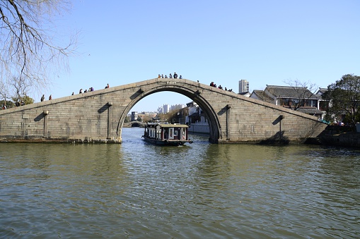 The Wumen Bridge crossing the canal near Panmen City Gate, the highest ancient bridge in Suzhou.  Jiangsu province, China