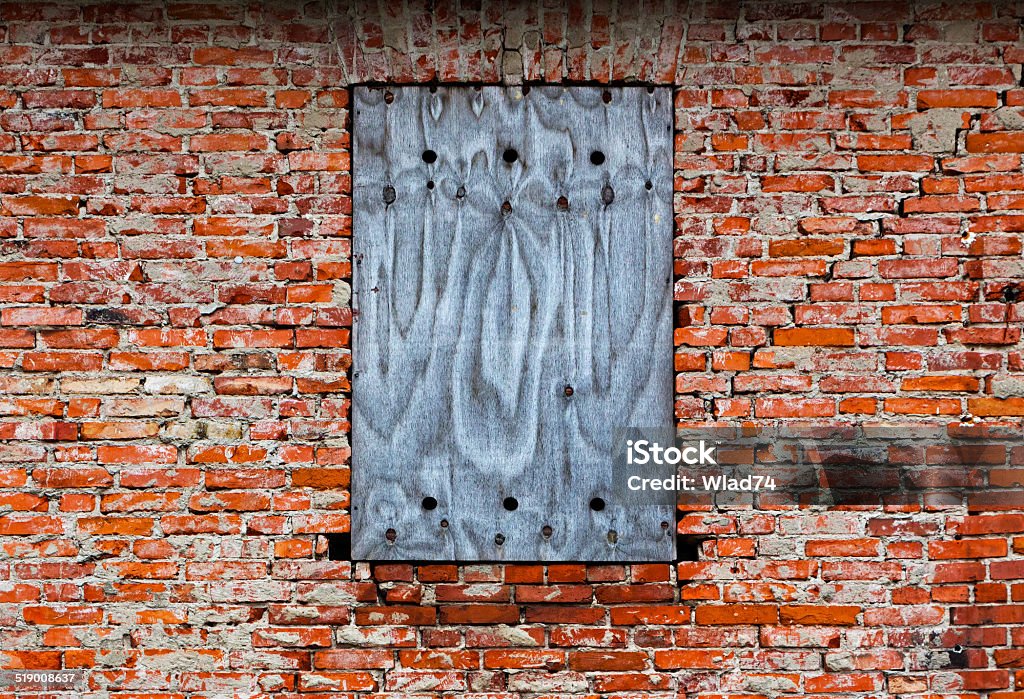 Bricked-up window on the old brick wall Bricked-up window on an old brick wall Abandoned Stock Photo