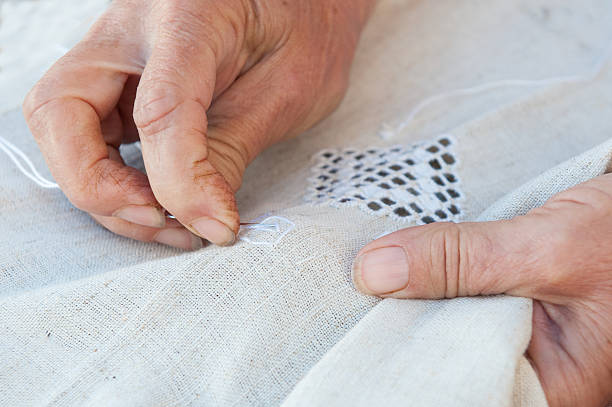 istock Senior Woman knitting 519008639