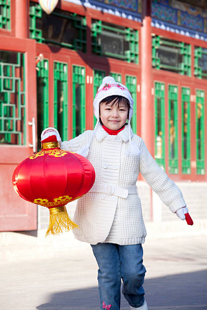 istock Young girl holding red lantern 519008765