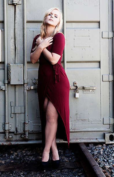 istock Blond Woman Standing Red Dress Outdoors Metal Container 519010718
