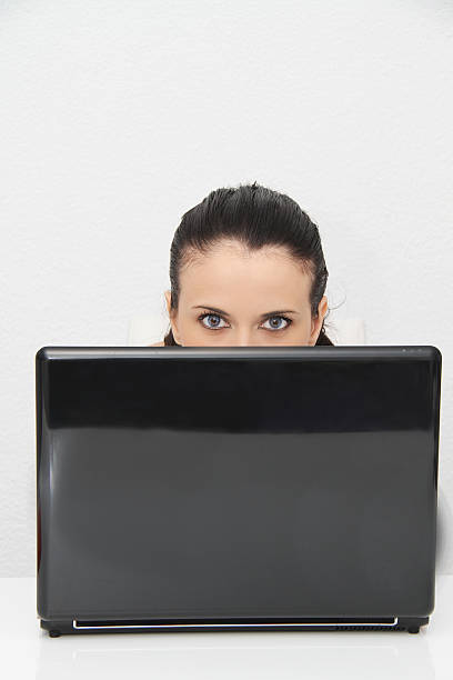 istock Attractive young woman working on her laptop at home 519012113