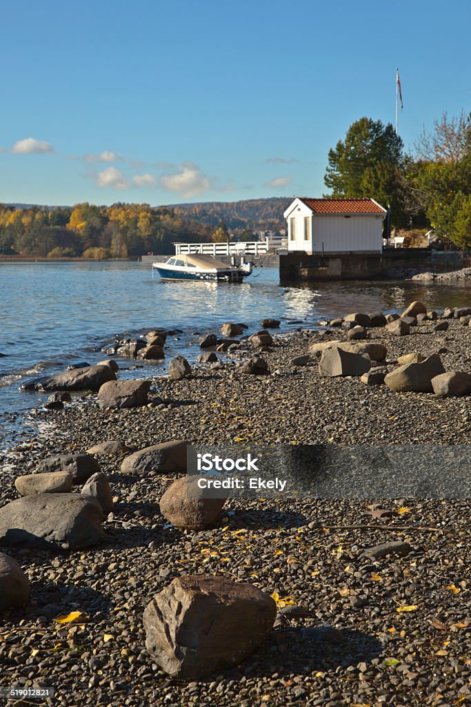 Boat house in fall. Boat house and speed boat in fall. Hovik, Norway. Beauty In Nature Stock Photo