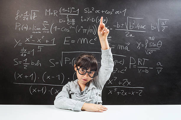 istock Little happy girl against blackboard. 519013137
