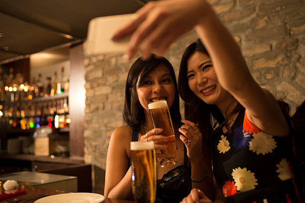 istock People drinking beer and taking pictures 519013192