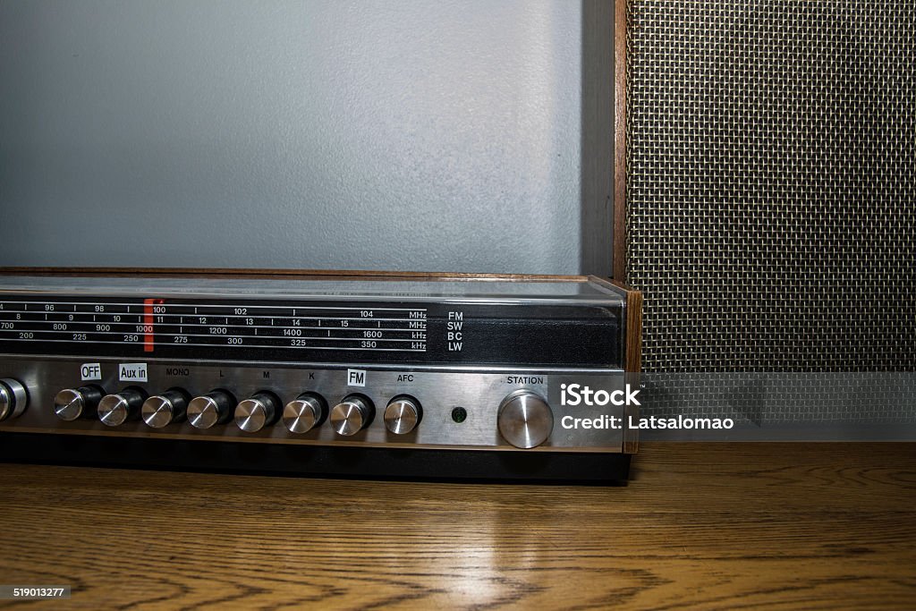 Vintage sound system detail Picture of a vintage sound system on top of a wooden table. Amplifier Stock Photo