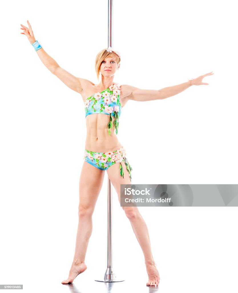 Pole dancing girl Young woman in a sports costume is performing the pole dance. Isolated on white 30-39 Years Stock Photo