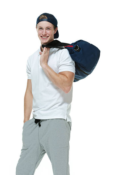 istock Cheerful man holding duffle bag 519024553