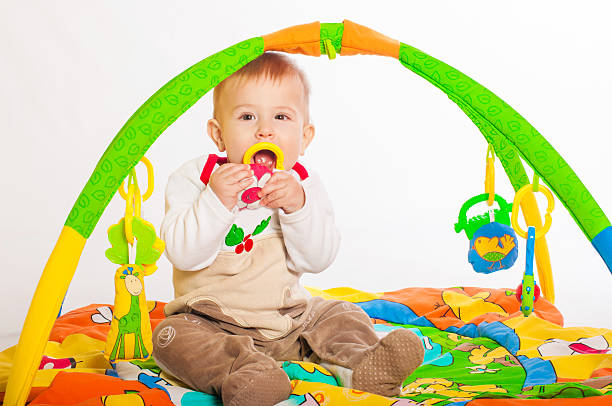 istock Baby boy playing with toys 519025045