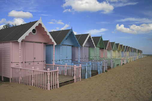 Colourful beach huts at West Mersea in Essex UK.