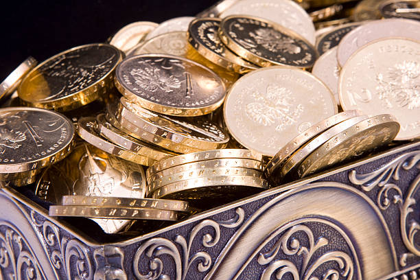istock gold casket and gold coins 519025309