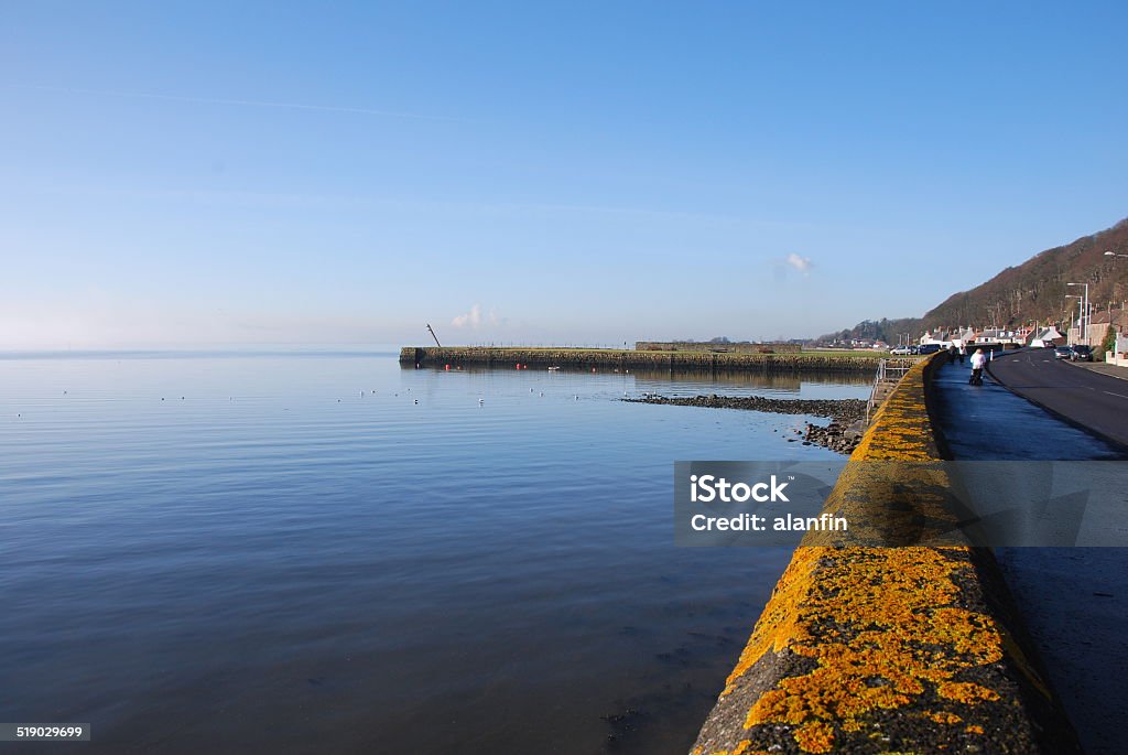 Limekilns Seafront A view along the coastal wall at Limekilns Coastline Stock Photo