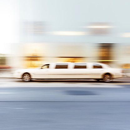 White Limousine speeding in New York - motion blur