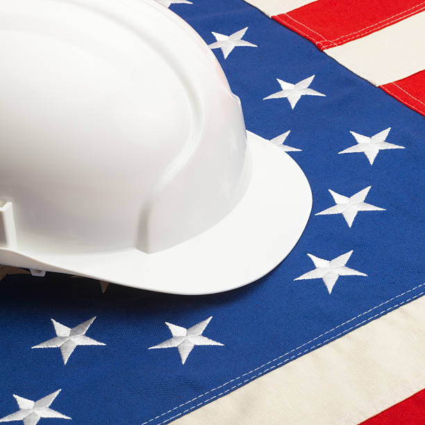 istock Construction helmet over US flag - 1 to 1 ratio 519031501