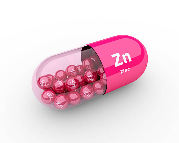cachets et zinc zn élément compléments alimentaires - zinc mineral nutritional supplement pill photos et images de collection