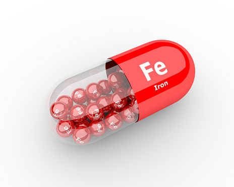 Píldoras con hierro Fe elemento suplementos dietéticos photo