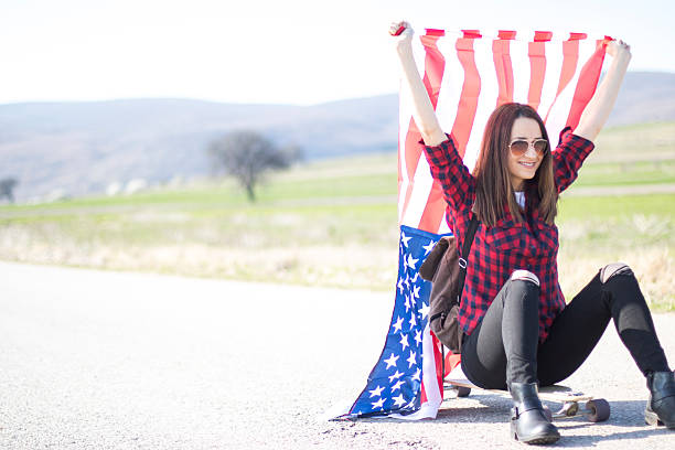 istock Woman holding an American flag 519038876