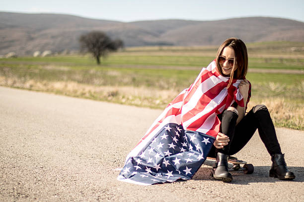 istock Woman holding an American flag 519039052
