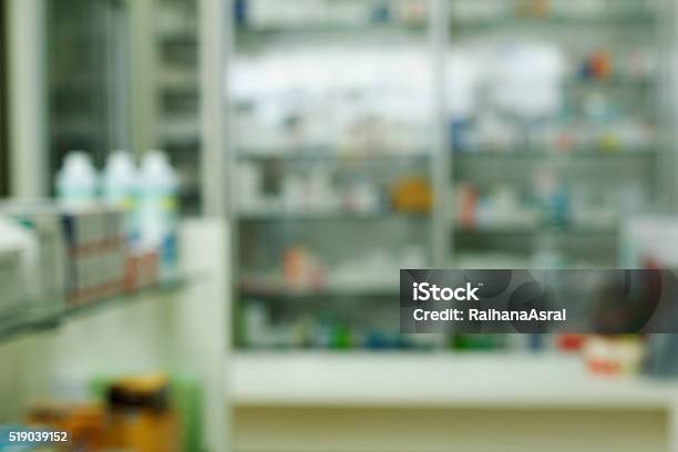 Blurred Pharmacy Drugstore Shelves And Counter Stock Photo - Download Image Now - Body Care, Business, Business Finance and Industry