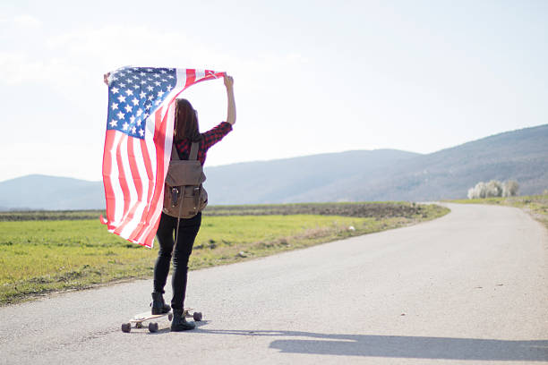 istock Woman holding an American flag 519039880