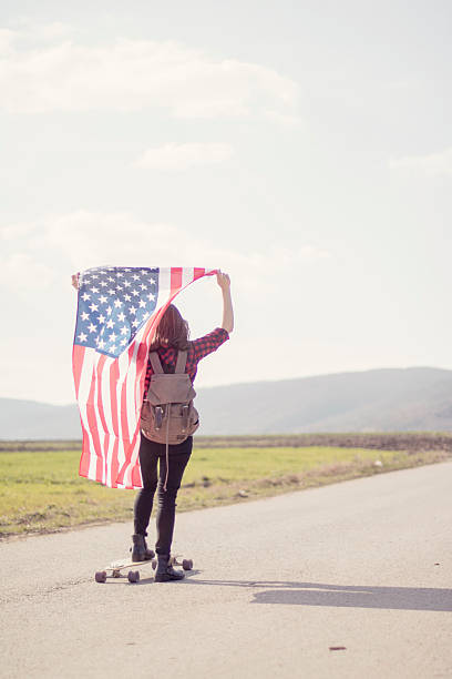 istock Woman holding an American flag 519040006