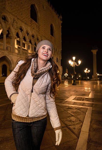 istock Happy young woman tourist sightseeing St. Mark's Square 519042436