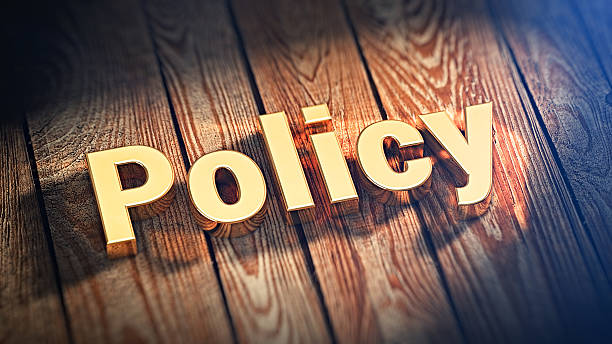 istock Word Policy on wood planks 519044474