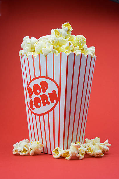 istock Classic box cinema popcorn on yellow background 519046565