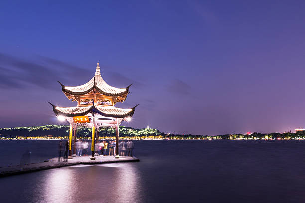illuminated ancient chinese pavilion in west lake,Hangzhou,china.