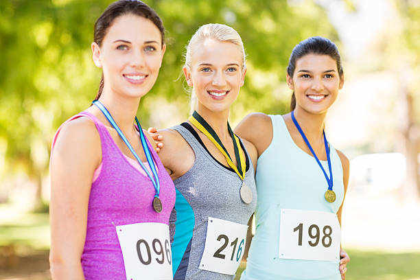 istock Marathon Runners Wearing Medals In Park 519047231