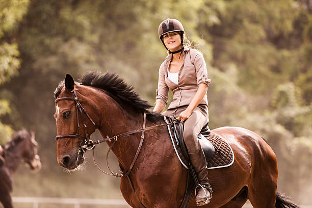 istock Woman horseback riding. 519047489