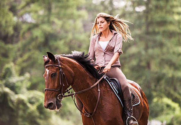 istock Woman enjoying while horseback riding. 519047495