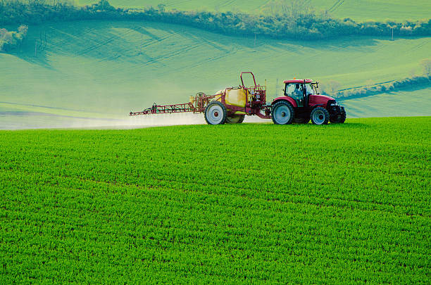 istock Farm machinery spraying insecticide 519047512