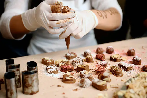 Confectioner decorated chocolates.