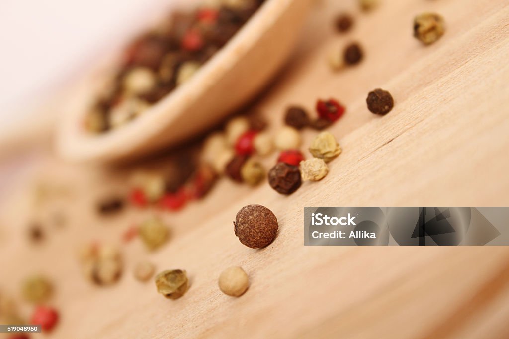 Spices in spoon Close-up of spices in wooden spoon on wooden surface Abundance Stock Photo