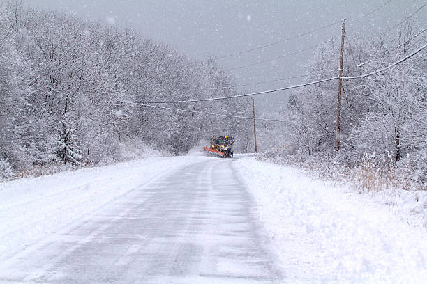 istock Snowy day with snow plow 519049505
