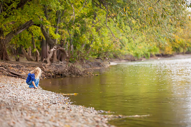 istock Girl Playing on Riverbank 519049823
