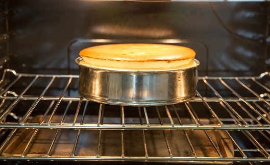 Homemade cheesecake rising in the oven.  rr