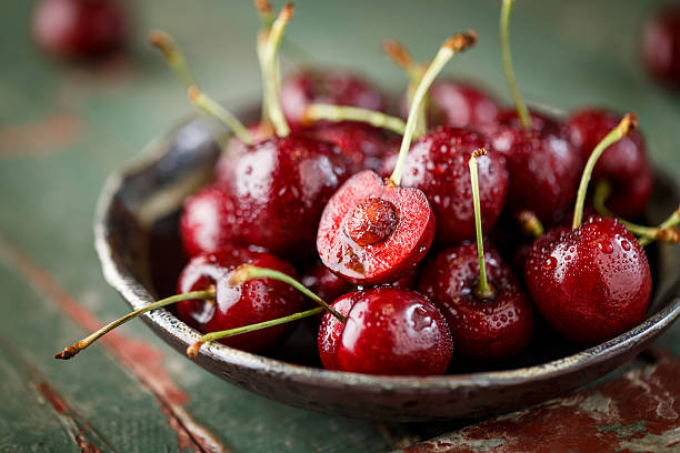 Close-up of fresh Cherry Close-up of fresh Cherry cherry coloured stock pictures, royalty-free photos & images