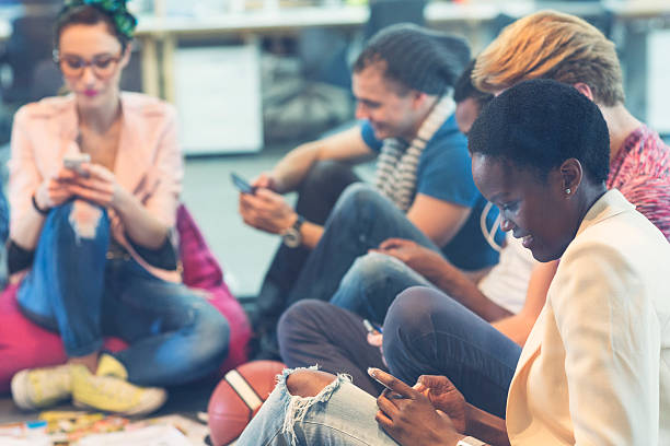 istock Multi-ethnic Startup Group of Young People typing on their phones. 519050553