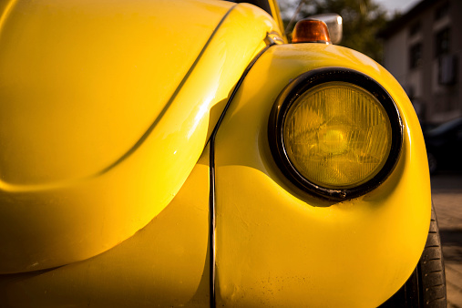 Izmir, Turkey - September 13, 2014: Yellow Volkswagen beetles headlight. Izmir Turkey 13 September 2014 .The Volkswagen Beetle, was an economy car produced by the German auto maker company Volkswagen.