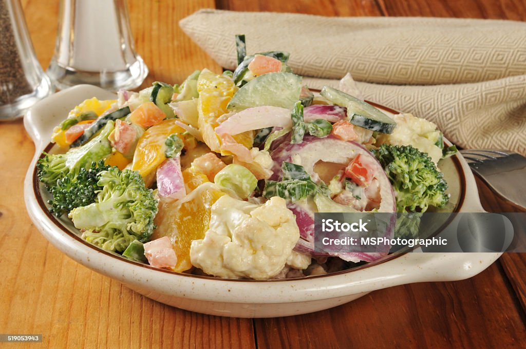 Veggie Caesar Salad A vegetable Caesar salad with broccoli, yellow peppers and cauliflower Broccoli Stock Photo