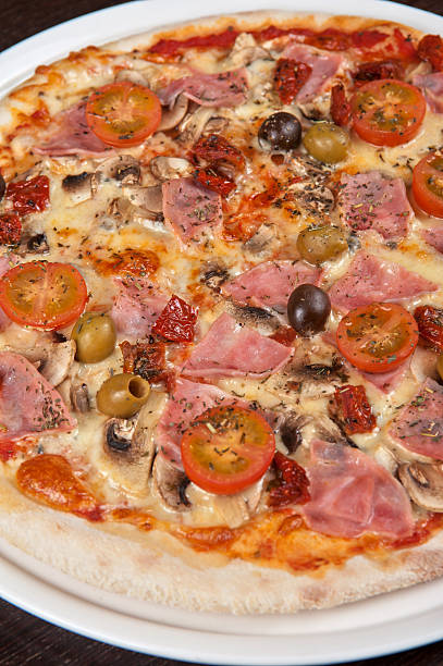 istock pizza with ham and mushrooms 519076581