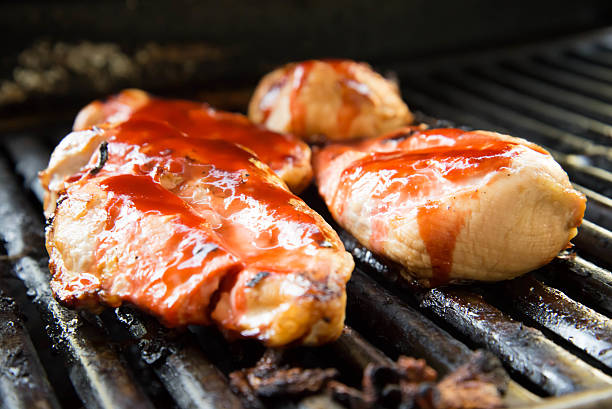 istock barbeque chicken cooking on the grill 519077181