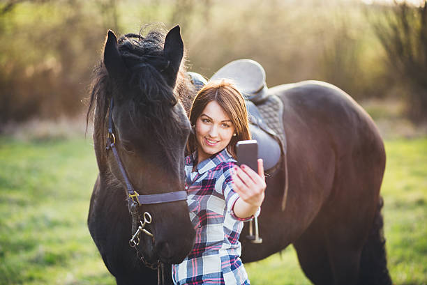 istock selfie photo with horse 519078250