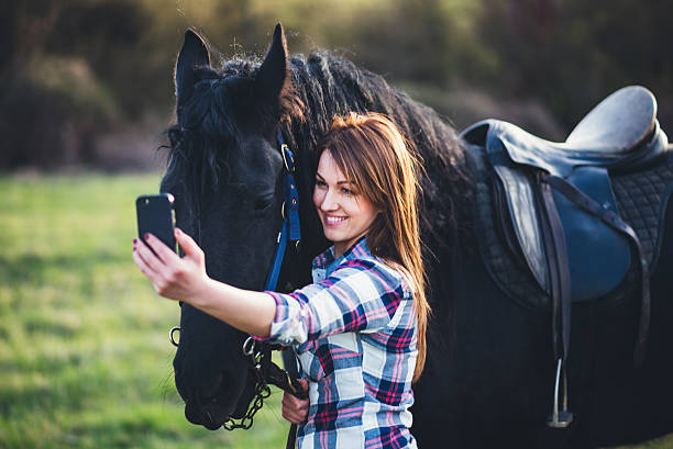 istock selfie photo with horse 519078378