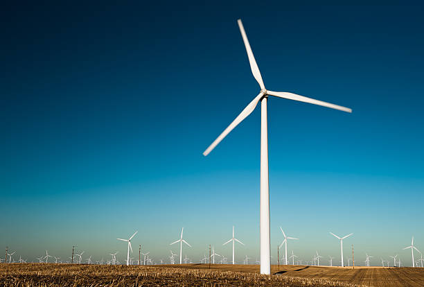 istock Windmill against a blue sky producing clean energy 519078703