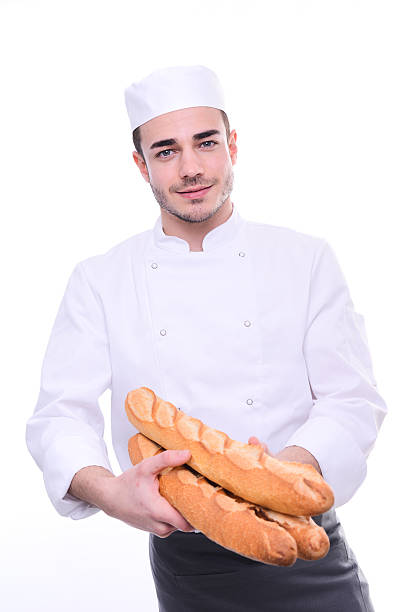 istock baker isolated white studio background holding traditional bread french baguettes 519079750