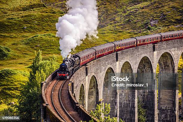 Glenfinnan Railway Viaduct In Scotland With A Steam Train Stock Photo - Download Image Now