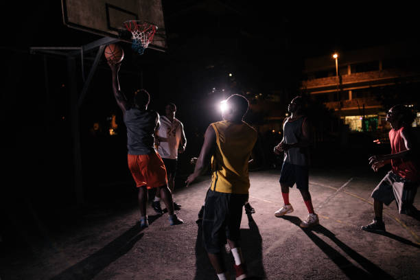 istock Basketball Players Playing in Court During Nighttime 519081466